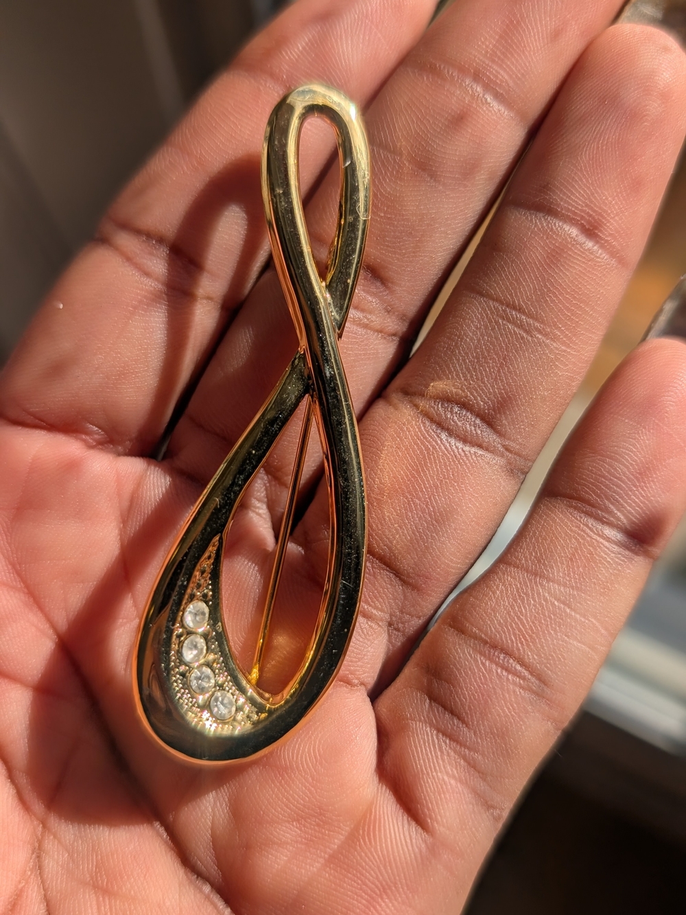 Gold-Tone Infinity Ribbon Brooch with Clear Rhinestones - Picture 2 of 3